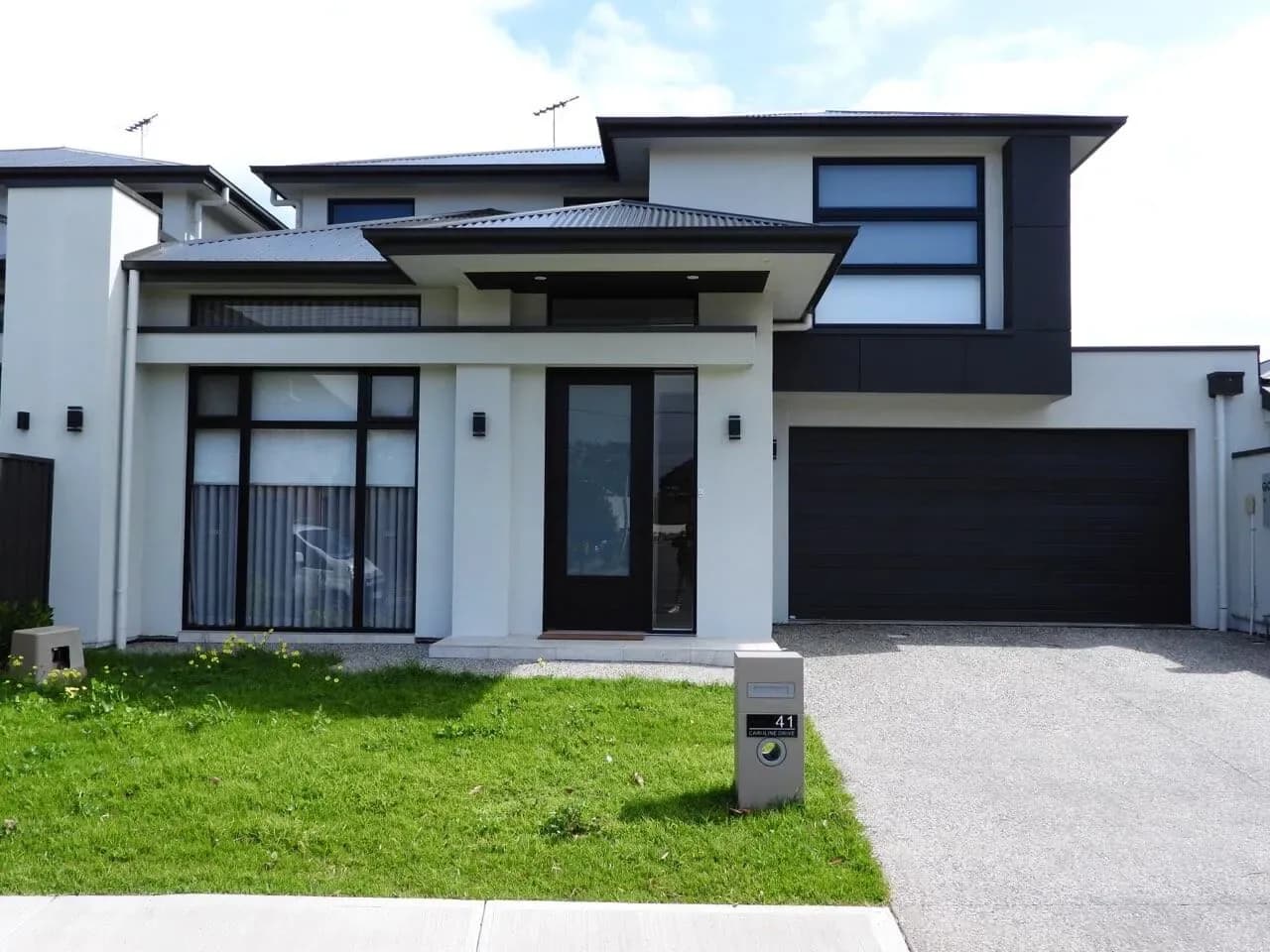 Contemporary Adelaide home with dark cladding and a landscaped frontage