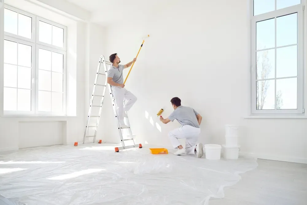 Elite Surface Group tradespeople rendering an interior wall